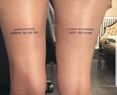 two people with tattoos on their legs that say, i walk towards the past and to the future