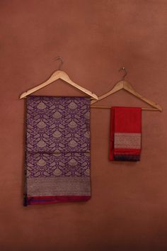 Radiate elegance on festive occasions in this beautiful purple Katan silk Banarasi saree with zari work. The saree has a pink edging. It comes with a matching blouse piece. Disclaimer: The shown stitched blouse on the model is for display purpose only. The saree comes with a matching blouse piece and finished with fall and piko. Disclaimer: The actual product may vary slightly from the image. These are custom orders, hence expect slight variation in color, placement of the motif or buta. ESTIMAT Purple Jamawar Saree, Purple Jamawar Saree With Self Design, Purple Saree With Border In Traditional Drape, Purple Jamawar Saree For Puja, Bollywood Style Purple Saree With Border, Festive Purple Saree With Border, Festive Purple Dupatta With Border, Festive Purple Jamawar Saree, Purple Chanderi Saree With Border