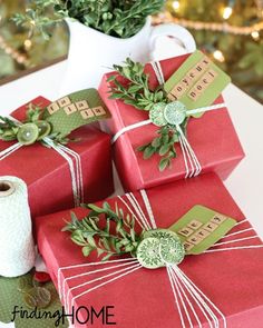 four wrapped presents sitting on top of a table