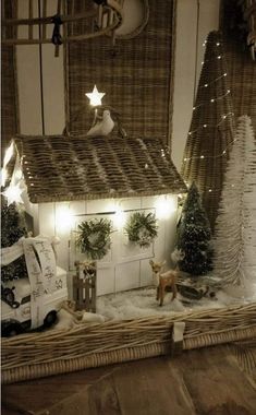 a christmas scene with a small house in the snow