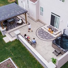 an aerial view of a patio with hot tub and grill