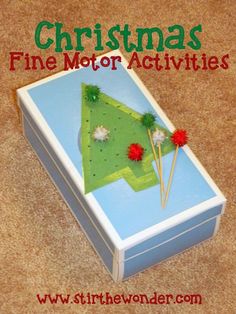 christmas fine motor activities in a box on the floor with text overlay that reads, christmas fine motor activities