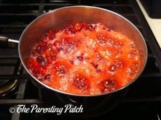 a pan filled with food sitting on top of a stove