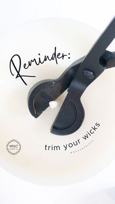 a pair of black scissors sitting on top of a white plate with the words reminder