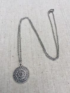 "This is a understated and elegant little boho disc pendant necklace. It is perfect for everyday wear and would go with just about anything. The disc measures 3/4\" long by 5/8\" wide and is made from allergy free plated silver. It hangs from a simple stainless steel necklace chain. I have matching earrings in my shop, if you would like the whole set. Here is the link https://etsy.me/2VZ551y Thanks for stopping by! Please take a moment and visit the rest of my Etsy shop. I have many more unique Bohemian Circle Metal Necklace, Bohemian Silver Medallion Necklace Nickel Free, Bohemian Silver Charm Necklace For Gift, Bohemian Silver Charm Necklace As Gift, Silver Bohemian Charm Necklace As Gift, Dainty Necklace With Delicate Chain For Festival, Vintage Silver Necklace With Adjustable Length, Silver Vintage Necklace With Adjustable Length, Bohemian Necklace With Coin Pendant Medallion