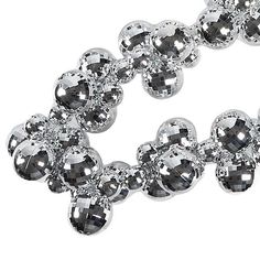 a silver bracelet with lots of balls on it