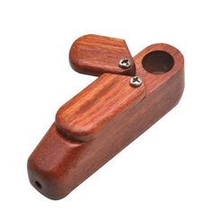 a small wooden object with two holes in the middle and one hole at the top