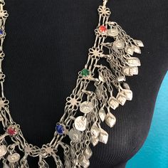 Superb vintage Kuchi necklace with multiple dangling pendants. This is a well loved, worn piece that's in great condition. Slips over the head, no clasp. Vintage Necklace With Large Pendant For Festivals, Vintage Necklaces With Large Pendant For Festivals, Vintage Necklace With Vintage Charm For Festivals, Vintage Necklaces With Vintage Charm For Festival, Vintage Festival Necklace With Vintage Charm, Festival Vintage Charm Metal Necklaces, Vintage Coin Necklace With Large Pendant, Handmade Vintage Dangle Chain Necklace, Bohemian Charm Necklaces For Vintage Collection