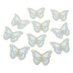 blue and gold butterfly appliques on white background