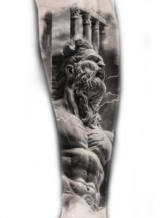 a man's leg with an image of a statue on it