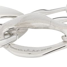 This is an authentic TIFFANY Sterling Silver Elsa Peretti Aegean Toggle Bracelet. The bracelet is crafted of sterling silver and features large abstract oval links and a toggle clasp for easy wear. Elsa Peretti, Toggle Bracelet, Large Abstract, Toggle Clasp, Easy Wear, Bracelet, Sterling Silver, Silver