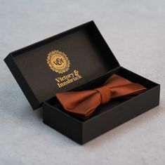 Rust Textured Bow Tie Introducing the Victory & Innsbruck Bow Tie Set, the original formal accessory for the modern gentleman.The ideal gift for yourself or that special someone. Perfect for weddings (especially to kit out all your groomsmen!), christenings, race days, balls, proms or any formal occasion.Rust Textured Finish Bow TieA textured finish Victory & Innsbruck bow tie in a rust colour. Ideal for any special occasion. Clip on fastening for ease and the guaranteed perfect finish. Vegan Fr Rust Bow Tie, Groomsmen Gifts Flask, Formal Accessories, Boys Ties, Bow Tie Set, Tie Gifts, Innsbruck, Modern Gentleman, Tie Set