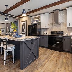 a large kitchen with an island in the middle