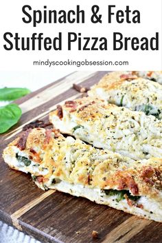 spinach and feta stuffed pizza bread on a cutting board