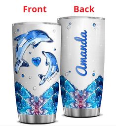 two dolphins are depicted on the side of this tumbler cup, which is decorated with blue and pink flowers