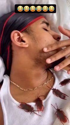 a man laying in bed with cockroaches on his face and hands covering his mouth