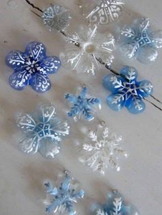 blue and white snowflakes are arranged on a table