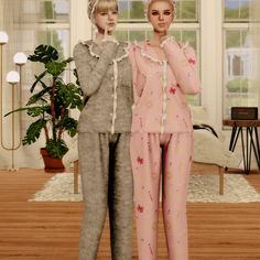 two women in pajamas standing next to each other