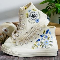 Custom Embroidered Converse, Carnation and Cornflower Embroidered Shoes, Blue Flax Embroidered Sneaker Custom, Flower Embroidery Converse, Unique Gift for Her 💚 Immerse yourself in the intricate craftsmanship as we lovingly hand embroider rustic flowers onto your chosen Converse pair 💚 🌿 The listed price encompasses both the Converse Shoes and the showcased Embroidery Designs. 1. MANUFACTURING PROCEDURE 🌿 Upon receiving your order, we initiate the shoe preparation process. If your chosen sho Embroidered Shoes Converse, Embroidered Converse, Cute Converse, Wedding Converse, Custom Converse, Embroidery Shoes, Embroidered Shoes, Sneakers Athletic, Womens Tie