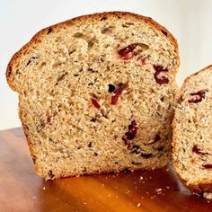 two pieces of bread sitting on top of a wooden table