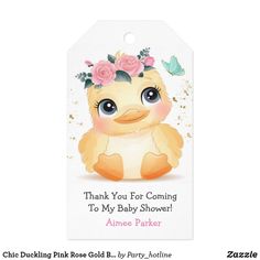 a baby shower tag with an image of a duck wearing a flower crown on it's head