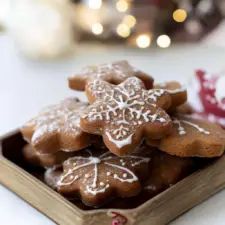 a wooden box filled with cookies on top of a table