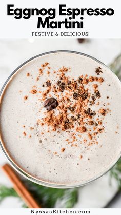 a close up of a drink in a glass with cinnamon sprinkles