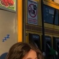 a girl standing in front of a vending machine