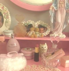 a shelf filled with lots of different types of items on top of a pink table