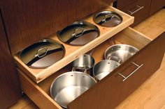 pots and pans are stored in the drawer