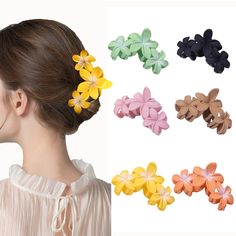 several different colored hair clips on a woman's head, including one with flowers in it