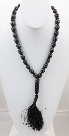 "For sale is an Authentic Antique Yemeni Black Coral Islamic 33 Prayer/Worry Beads Necklace. Necklace has 36 beads total, 33 beads are old and rare black coral oval beads with silver inlaid nails in a chevron shaped band and inlaid silver rings, 2 beads are small black coral disc beads and the other is the large cylindrical pendant bead. Most of the beads are in excellent condition, some of the beads may have some light wear/scratches/small chipping and missing silver inlays characteristic of th Traditional Black Beads For Gift, Traditional Black Round Beads Necklace, Traditional Black Necklace With Round Beads, Black Spiritual Beaded Necklaces With Polished Beads, Vintage Black Beads For Gift, Vintage Black Beads For Gifts, Traditional Black Beaded Necklace, Traditional Handmade Black Beads, Handmade Traditional Black Beads