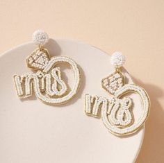 "💍Diamond ring shaped beaded dangling earrings with \"MRS\" letters details 💍 Details: * Size: 2.75\" x 2.5\" * Post Back * Lightweight  * Felt Back *These are handmade so there may be slight variation in shape and size* * This item may be larger than it seems in the image. Please check the dimensions*" White Beaded Hoop Earrings For Wedding, Beaded Hoop Earrings For Wedding, Round Beaded Earrings With Dangling Beads For Wedding, Round Beaded Dangling Earrings For Wedding, Beaded Wedding Earrings, Bachelorette Earrings, Diamond Ring Shape, Ring Bride, Earrings Bride