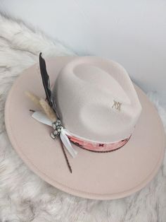 Neutral hat with a pop of the cutest pink bandana band wide brim fedora hat.   This hat is perfect for any cowgirl, country concert, girls trip or for that special occasion!   This hat has a pink bandana band with some layered ribbon, leather cording, and feather cluster along with the cutest cactus pin! There is custom stitching on the side and top brim for an extra special touch. This is a neutral color hat that can be matched to any outfit. This is a cream colored hat made of a polyblend. Thi Summer Brimmed Felt Hat For Western-themed Events, White Hat Band For Spring Ranch Occasions, Summer Ranch Felt Hat With Flat Brim, White Hat Bands For Spring Ranch, Spring White Hat Band For Ranch, Country Style Brimmed Fedora (one Size Fits Most), Trendy Wide Brim Pink Sun Hat, Trendy Pink Wide Brim Sun Hat, Rodeo Brimmed Fedora