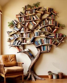 a tree shaped bookshelf in the corner of a room