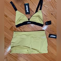 New With Tags. Yellow And Black Prince Bra/Sports Top. Adjustable Straps, Cotton/Polyester Fabric. Yellow Thick Cotton Fabric Tennis Skirt, With Attached Shorts Underneath. Super Cute Set. Size Medium. Urban Yellow Sports Tops, Cheap Yellow Gym Tops, Yellow Adidas Sporty Top, Yellow Sports Tank Top, Yellow Moisture-wicking Sports Bra For Athleisure, Cotton Polyester Fabric, Cute Sets, Sports Top, Tennis Skirt