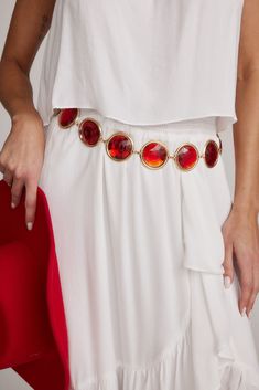 Add a pop of cool to your festival look with our Ruby Red Stone Chain Belt. This trendy accessory features a sleek gold chain and eye-catching red stones – a perfect fit for your cool-girl vibe. Upgrade your look effortlessly and rock some red! Fall Wardrobe Staples, Concert Dresses, 12th Tribe, Girl Vibe, Denim And Diamonds, Bridal Tops, Red Stones, Night Tops, Fall Wedding Guest Dress