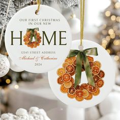 two ornaments hanging from a christmas tree with the words, home and oranges on them