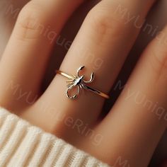 *Free engravings up to 20 characters* Embrace the mystique of the desert with this minimalist scorpion ring! 🌟 It's a bold adornment for your finger or an ideal gift for anyone who finds fascination in the unique and powerful symbolism of scorpions. 🦂💕 This ring is perfect for stacking or making a statement on its own, capturing the essence of the scorpion's resilience and striking presence. Meticulously crafted, it features a minimalist scorpion design along a delicate band, embodying the enigmatic spirit of the desert. Whether you're drawn to the intrigue of these creatures or seeking a distinct piece of jewelry, this scorpion ring is a compelling and edgy choice, ready to accompany you on every daring adventure.  band width: 1.5mm Feel free to message us for customization! We can usu Minimalist Scorpion, Scorpion Jewelry, Desert Jewelry, Fashion Core, Gold Scorpion, Scorpio Ring, Scorpion Design, Scorpion Ring, The Scorpions