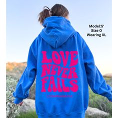 Love Never Fails Hoodie Bible Verse Christian Hoodie Preppy Christian Sweatshirt Oversized Hoodie Trendy Sweatshirts Bible Verse Corinthians ~ PRODUCT DETAILS ~ ❤ Gildan Brand ❤ 50% Cotton, 50% Polyester ❤ DTG (Direct to Garment) Printing. The Ink is printed directly into the fabric. There is no Vinyl used. ~ SIZING ~ ❤ Unisex Sizing ❤ Please refer to size guide in product images to ensure you are choosing the correct fit. ~ CARE INSTRUCTIONS ~ ❤ Wash inside out with cold water ❤ Lay flat to dry ❤ Do not dry clean ❤ Try to avoid ironing the design ❤ Tumble dry low ~ RETURNS/EXHANGES ~ ❤ Please note; your product is made to order & Returns are not accepted. Exchanges are ok. ❤ Please make sure all sizing & Shipping information is correct before ordering. ❤ We are not responsible for Incorre Relaxed Fit Slogan Hoodie For Loungewear, Drop Shoulder Hoodie With Letter Print For Fall, Fall Slogan Hoodie For Loungewear, Casual Slogan Hoodie For Loungewear, Winter Letter Print Drop Shoulder Hoodie, Winter Hoodie With Slogan In Relaxed Fit, Oversized Hooded Top With Slogan, Relaxed Fit Winter Hoodie With Slogan, Long Sleeve Hoodie With Slogan For Loungewear