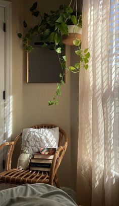 a wicker chair sitting in front of a window