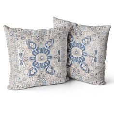 two pillows with blue and white designs on them