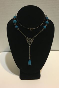 "Unique! Antique Art Deco piece blue Czech bead lariat necklace never seen one like it the measures 22\" long and hangs down 3.75\" pendant in very good condition." Blue Teardrop Drop Necklace For Formal Occasions, Formal Blue Teardrop Drop Necklace, Formal Blue Drop Necklace, Elegant Turquoise Beaded Lariat Necklace, Blue Teardrop Polished Bead Necklaces, Blue Teardrop Necklace With Polished Beads, Blue Dangle Necklaces For Formal Occasions, Blue Beaded Lariat Necklace, Elegant Adjustable Long Turquoise Necklace