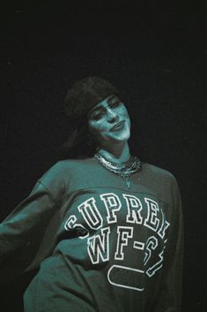 a man with his face painted in white and wearing a black sweatshirt that says upper wif