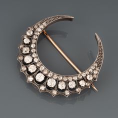 A very beautiful antique brooch, made circa 1880. Made in rose gold 18k and silver. The crescent is big it measures 44mm diameter. The diamonds are quality. Clarity is Vs2 /SI1.  Weight: 13.30 grams Crescent Jewelry With Intricate Design, Victorian Crescent Wedding Jewelry, Gold Crescent Jewelry With Diamond Accents, Antique Silver Crescent Jewelry, Handmade Crescent Antique Jewelry, Vintage Gold Crescent Brooches, Art Deco Diamond Rings, French Jewelry, Snake Bracelet