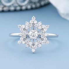 "\"Warm up winter with the glow of gold and diamonds. This snowflake-shaped engagement ring presents solitaire round diamonds in white gold in a look as elegantly cool as newly fallen snow.  Main | Centre Diamond Information:- Shape:-              Round Size(mm):-         2.9 Weight:-             0.1Carat Color:-                G-H Clarity:-              VS-SI  Setting Type:-   Six Prong Side Diamond Information:- Shape: -             Round Size(mm):-         1.1 Weight:-             0.252Carat Color:-                G-H Clarity:-              VS-SI  Setting Type:-   Surface Prong Total Diamond Weight:-   0.352Carat Ring Measurement Information in brief:-  Height/thickness on Top side is 3.4mm Height/thickness on Bottom side is 1.5mm Width on Top side is 13.3mm Width on Bottom side is 1.5m Snowflake Wedding Ring, Snowflake Engagement Rings, Snowflake Inspired Engagement Ring, Christmas Engagement Ring, Engagement Ring Snowflake, Snowflake Diamond Ring, Snowflake Engagement Ring Vintage, Sapphire Snowflake Ring, Snowflake Engagement Ring