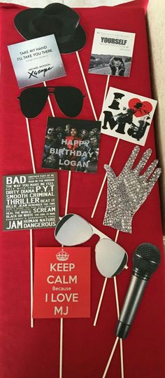 a red sheet with some stickers and other items on it that say keep calm i love you