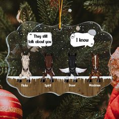 an ornament hanging from a christmas tree with three horses on it, one saying they still talk about you and the other saying i know