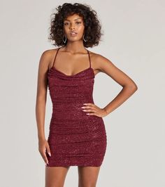 This sparkling glitter mini dress flaunts a cowl neckline and a revealing open back with a rhinestone embellished strap for a glam effect. Perfect for styling with heels for homecoming or a birthday.Fit & FeaturesGlitter fabric, sewn-in knit lining, moderate stretchCowl neckline, padded bra cupsAdjustable spaghetti straps, crisscross backOpen back, rhinestone embellished strapSide ruched seamsBodycon mini-length silhouetteRuns true to size Glamorous Evening Mini Dress With Cowl Neck, Glamorous Fitted Cowl Neck Dresses, Glamorous Cowl Neck Dress For Night Out, Glamorous Cowl Neck Mini Dress For Party, Glamorous Mini Dress With Cowl Neck For Night Out, Glamorous Cowl Neck Mini Dress For Night Out, Glamorous Cowl Neck Dress For Party Season, Cowl Neck Party Dress For Party Season, Sparkling Mini Bodycon Dress For Date Night