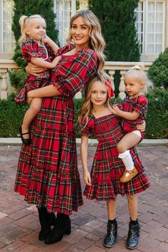 SHE'S BACK!! Our all-time favorite Madeline Dress in Holiday Plaid. Featuring our best-selling silhouette and a festive plaid print! Flowy, feminine, and functional. Everything this carefree midi-length women's dress is made of. Inspired by family time, fireplaces, and cozy evenings with friends. Smocked bodice with puff sleeves and ruffle details finish it off. Available in matching looks for the whole family! Mom Daughter Christmas Outfits, Matching Christmas Dresses, Red Plaid Family Pictures, Tartan Holiday Outfit, Teen Christmas Dress, Holiday Family Pictures Outfits, Christmas Family Outfits For Pictures, Santa Pictures With Kids Outfits, Christmas Family Photos Outdoor Outfits